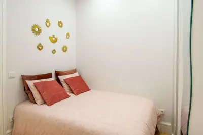 a bedroom with a bed with orange pillows at Riverside Cozy Studio by LovelyStay in Porto