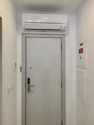 a white door in a room with a ceiling at Almada Downtown 202 in Porto