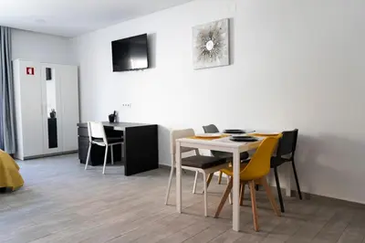 a dining room with a table and chairs at Almada Downtown 203 in Porto