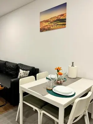 a white table and chairs in a living room at Almada Downtown 302 in Porto