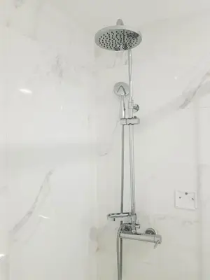 a shower with a shower head in a bathroom at Almada Downtown 303 in Porto