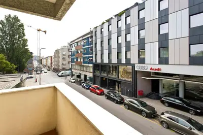 a view of a street with cars parked in front of buildings at APOSENTUS - Marta's House in Porto