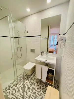 a bathroom with a sink and a shower and a toilet at Oporto Chic & Cozy - Mercadores in Porto