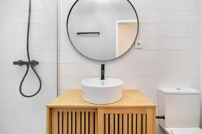 a bathroom with a sink and a mirror at Whome Formosa #3 - Central 2-Bed in Prime Location Perfect to Explore Porto in Porto