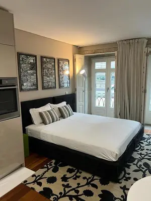 a bedroom with a large bed in a room at Oporto Chic & Cozy Cardosas in Porto