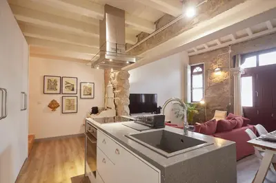 a kitchen with a sink and a living room at Maison214 in Vila Nova de Gaia