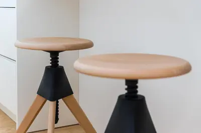 a pair of stools in front of a kitchen at Door 65 - Historical Center Apartments in Porto