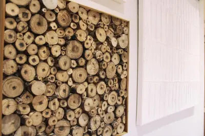 a wall of wood logs next to a window at Artistic Neighborhood Luxury in Porto