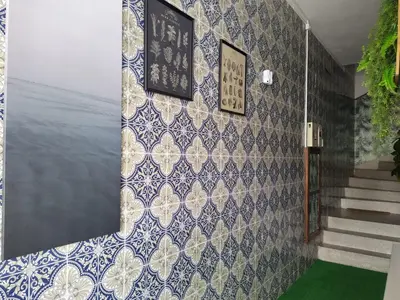 a hallway with blue and white tiles on a wall at Porto Grand Sasimi House in Porto