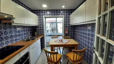 two beds in a small room with a window at taol in Vila Nova de Gaia