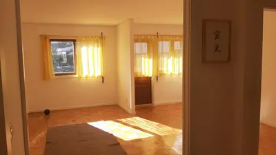 an empty living room with yellow curtains and a rug at taol in Vila Nova de Gaia