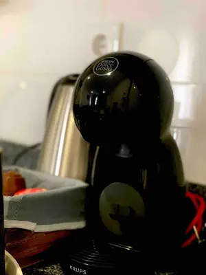 a black mixer sitting on top of a kitchen counter at Almada Downtown 102 in Porto