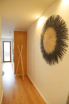 a living room with a large painting on the wall at Casa do Pilar - D. Luís I in Vila Nova de Gaia