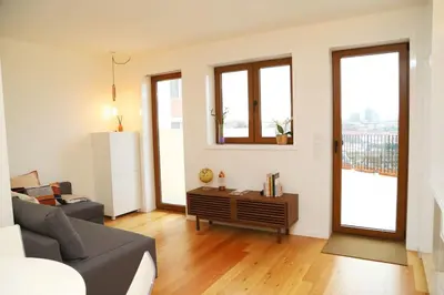 a living room with a couch and a table at Casa do Pilar - D. Luís I in Vila Nova de Gaia