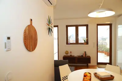 a living room with a couch and a table at Casa do Pilar - D. Luís I in Vila Nova de Gaia