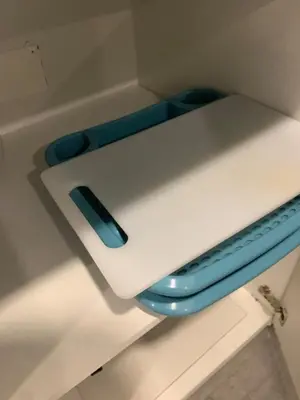 a laptop sitting on top of a shelf at Almada Downtown 201 in Porto