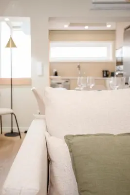 a white bowl sitting on top of a wooden table at Liiiving in Porto - Uptown Pearl Apartment in Porto