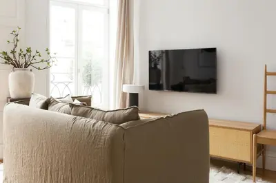 a living room with a couch and a table at VIVA Merchant's Way in Porto