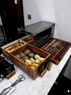 two baskets of different types of donuts on a counter at Oca Ribeira do Porto AT in Porto