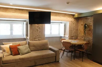 a living room with a couch and a table at Oca Ribeira do Porto AT in Porto