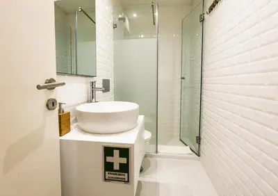 a room with a table and chairs and a bed at Cozy apartment in the center of Porto in Porto