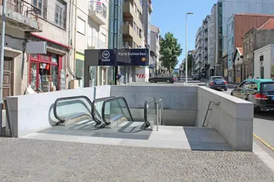 a bench on the side of a city street at Oporto Cozy Flats in Porto