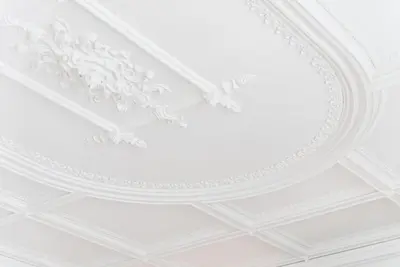 a white ceiling with a fancy design on it at GuestReady - Seaside getaway in Porto in Porto