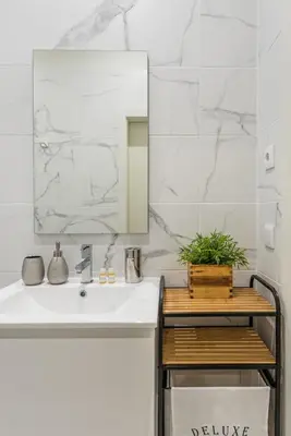 a bathroom with a sink and a mirror at GuestReady - Seaside getaway in Porto in Porto