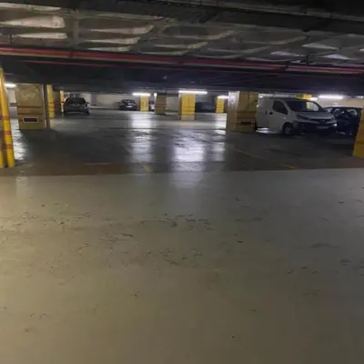 an empty parking garage with cars parked in it at 504 New Apartment Galé in Porto