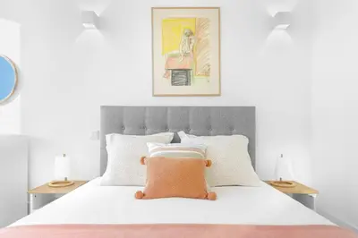 a bedroom with a bed with a pillow on it at República Garden View in Porto