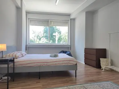 a bedroom with a bed and a window at DISCOVER PORTO - Boavista 2 in Porto