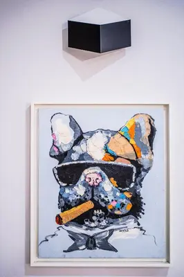 a painting of a dog holding a cigarette at Emotions Lapa Flat in Porto