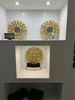 a shelf with three mirrors and a cake on it at Modern & Central 3 minutes from the River in Vila Nova de Gaia