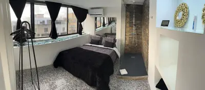 a bedroom with a bed in a room with a window at Modern Room with Indoor Shower Near the River - Quarto Moderno com Duche interior Próximo da Ribeira in Vila Nova de Gaia