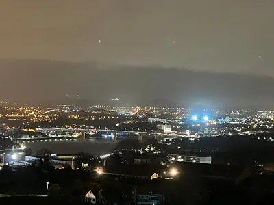 a view of a city at night with lights at Modern Room with Indoor Shower Near the River - Quarto Moderno com Duche interior Próximo da Ribeira in Vila Nova de Gaia