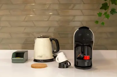 a coffee maker and a coffee pot on a counter at WALAA Home@Almada Terrace by LovelyStay in Porto