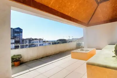 a large balcony with a view of a city at Asgard Oporto Downtown Apartments in Porto