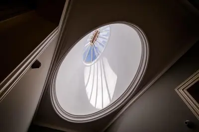 a round window in the ceiling of a room at Maria Pia Luxury Apartment, Historic House Downtow in Porto