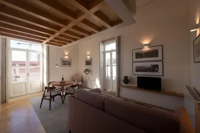 a living room with a couch and a table at Maria Pia Luxury Apartment, Historic House Downtow in Porto