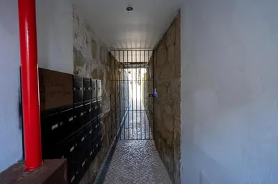 a long hallway with stalls in a building at Ilha D’ouro House S. Vitor in Porto