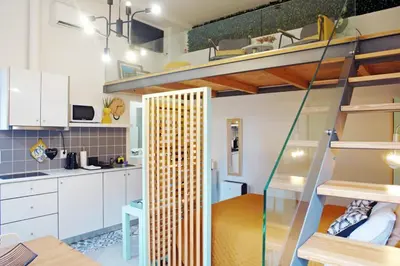 a room with a kitchen and a bunk bed at Ilha D’ouro House S. Vitor in Porto
