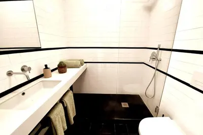 a bathroom with a sink and a toilet at Dream On - Aliados Delux 2 Bed in Porto
