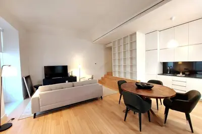 a living room with a couch and a table at Dream On - Aliados Delux 2 Bed in Porto