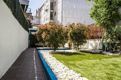 a garden with rocks and trees in a building at Porto InLapa Apartment II Terrace in Porto