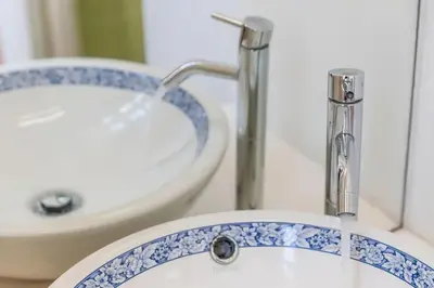 a bathroom with a sink and a toilet at InLapa Studio III in Porto