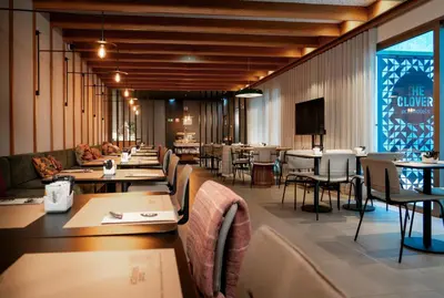 a dining room with tables and chairs and tablesktop at Acta The Clover in Porto