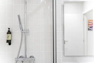 a shower in a bathroom with a glass door at Lovely Balcony Porto Downtown in Porto