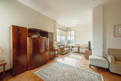 a living room with a couch and a table at Grand Botanic Garden Apartment by Vacationy in Porto