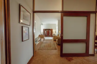 a hallway with a door leading to a living room at Grand Botanic Garden Apartment by Vacationy in Porto