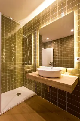 a bathroom with a sink and a mirror at Aposentus - Your home in Porto in Porto